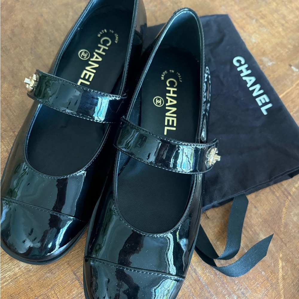 CHANEL Black Patent Mary Jane Flats with Gold CC Accent